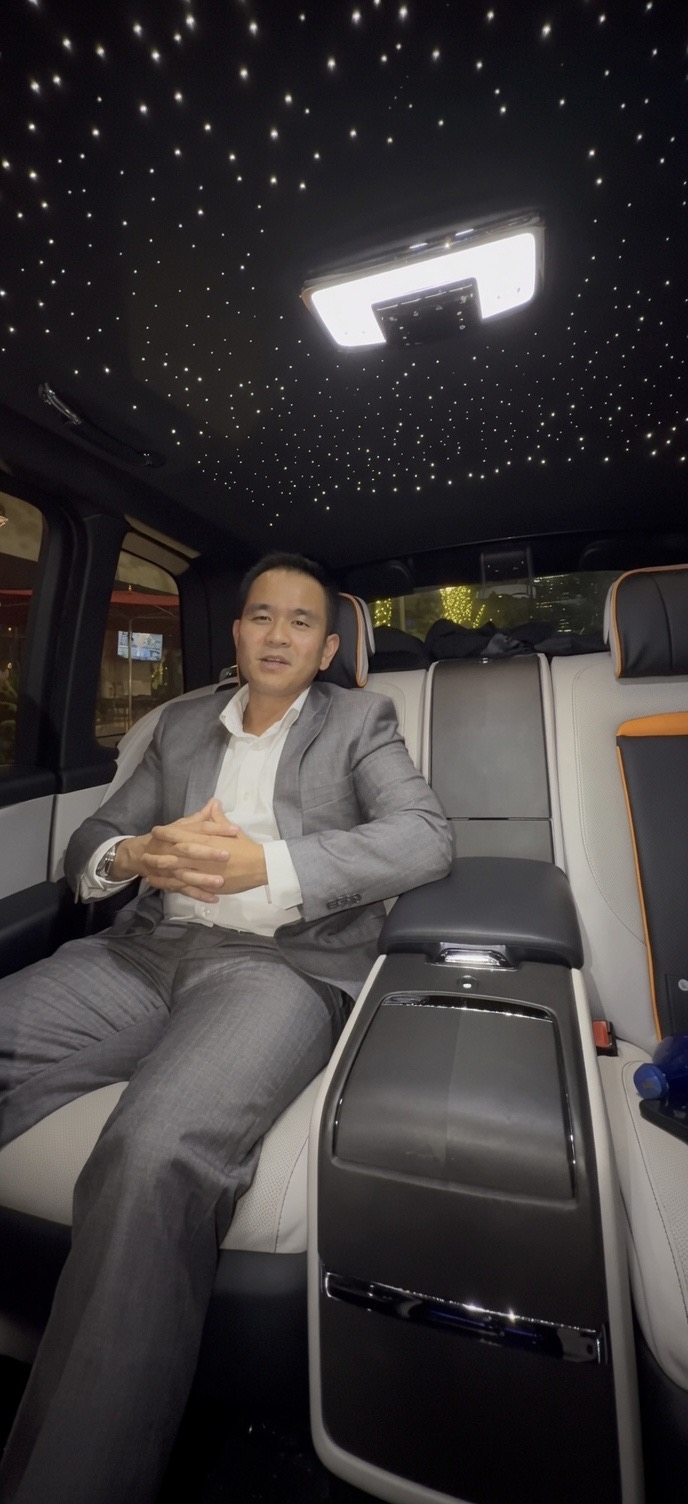 Sam Doan in a luxury vehicle with a starlight headliner